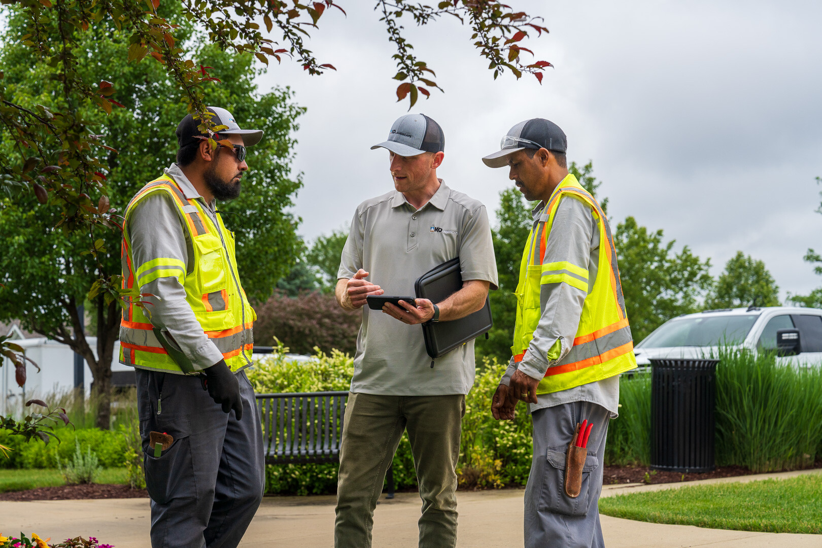 commercial HOA account manager and crew reviewing project 3