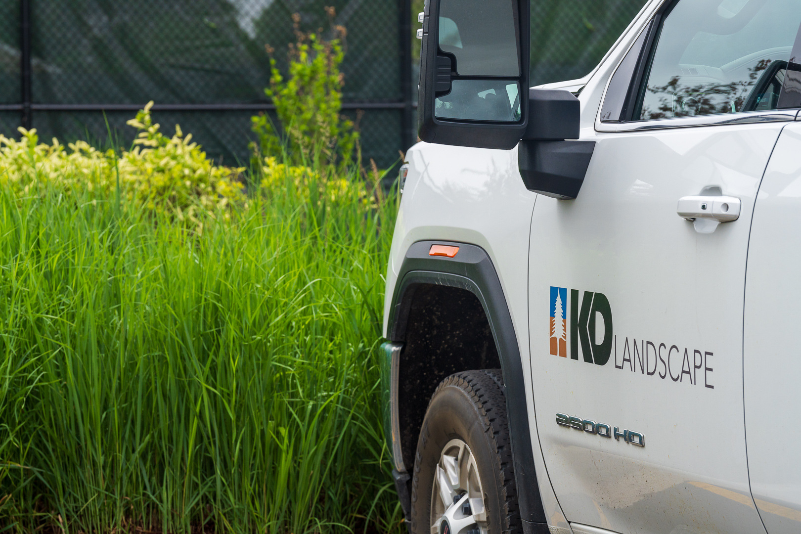 crew truck logo grasses planting bed