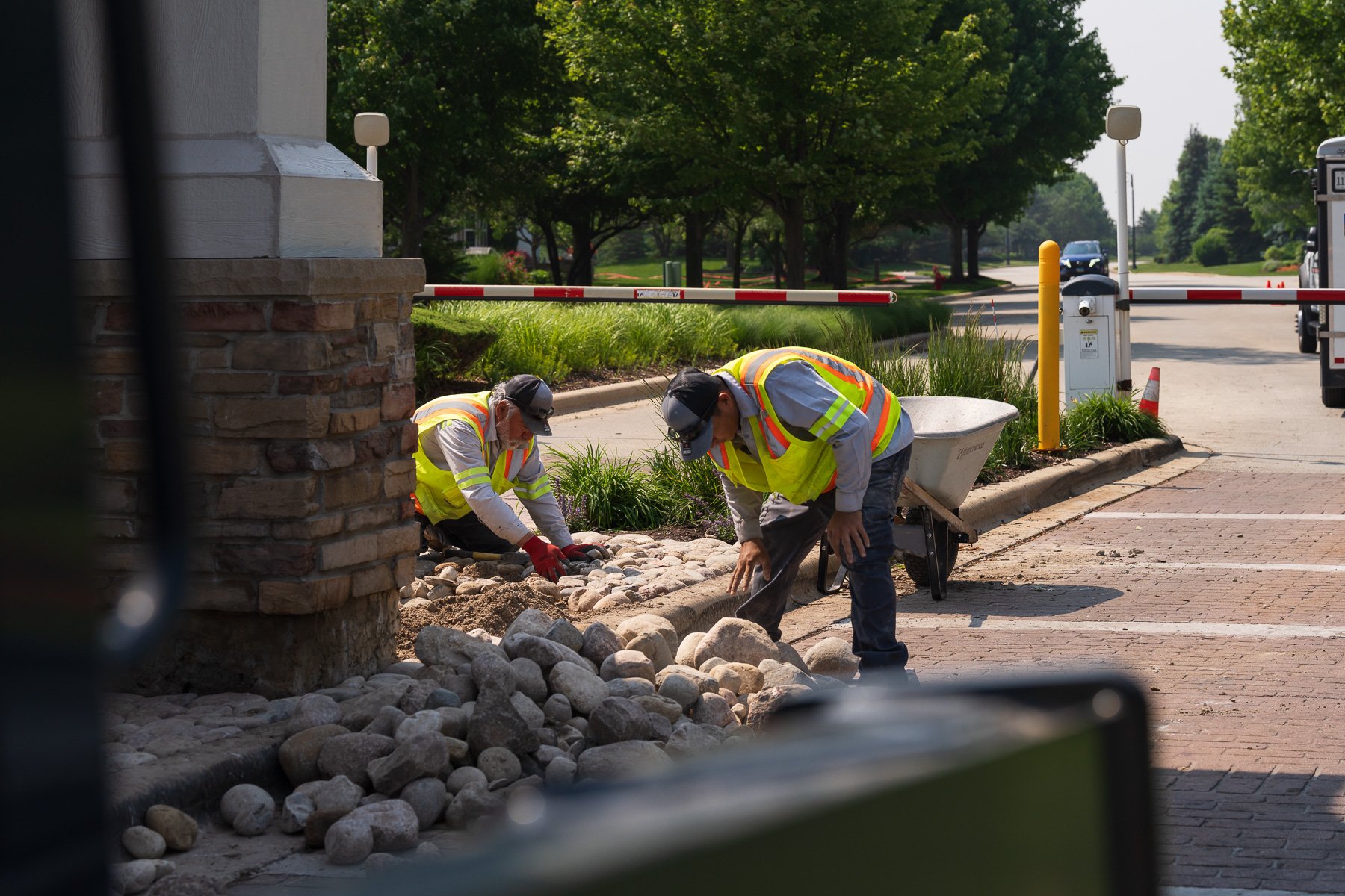 hoa crew team enhancements river rock sign hardscape plants 17