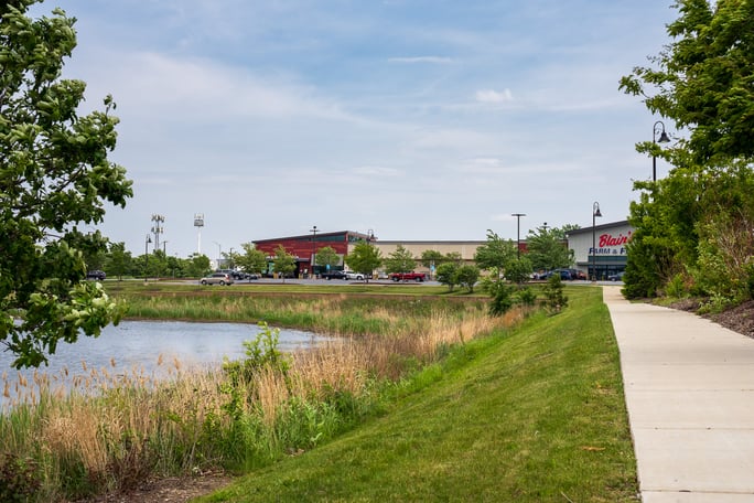 plants and detention pond on retail property landscape