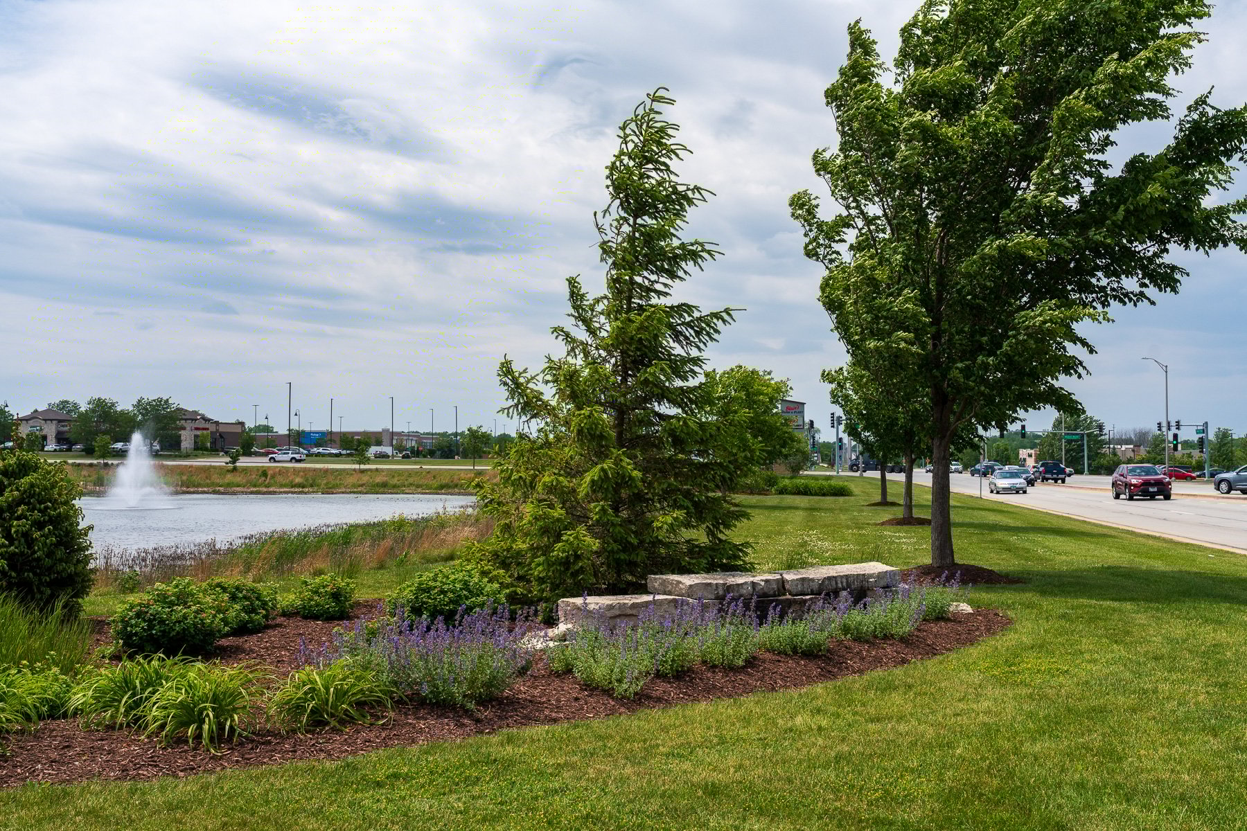 planting bed trees entrance sign pond lawn maintenance