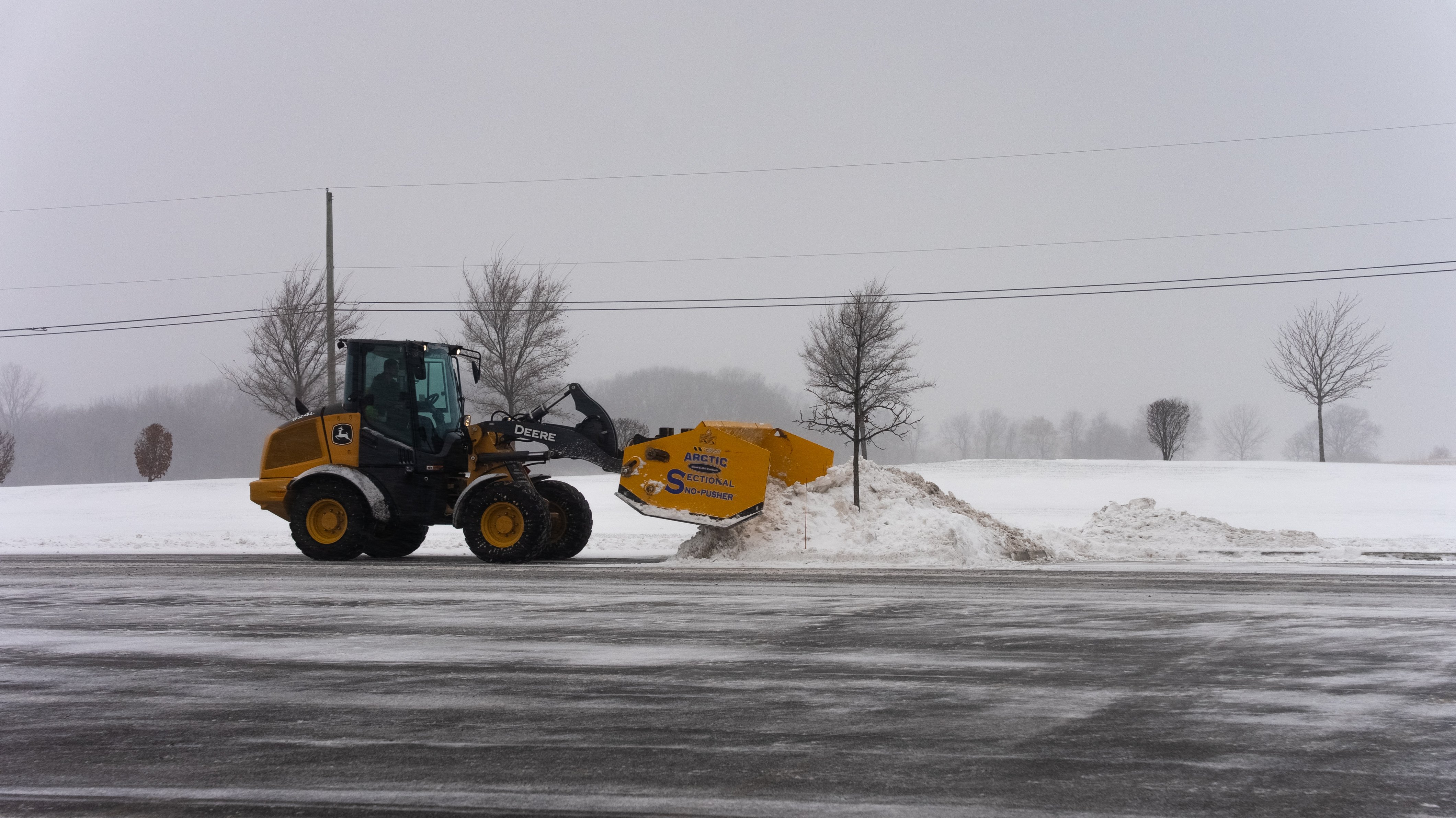 snow removal large parking lot snow pusher industrial warehouse