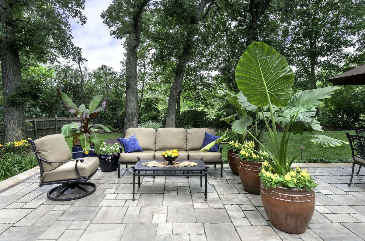 patio with seating area and container gardens