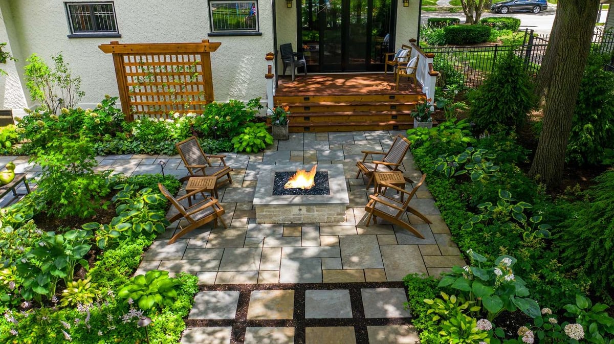 patio with beautiful plantings and fire pit