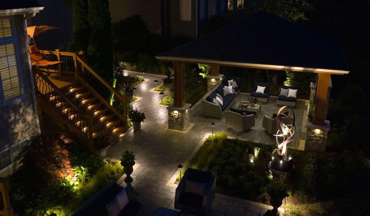 landscape lighting and patio with walkway and pavilion