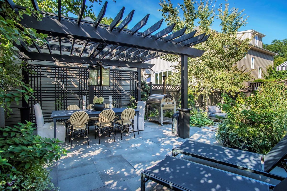 pergola over table to provide shade in backyard