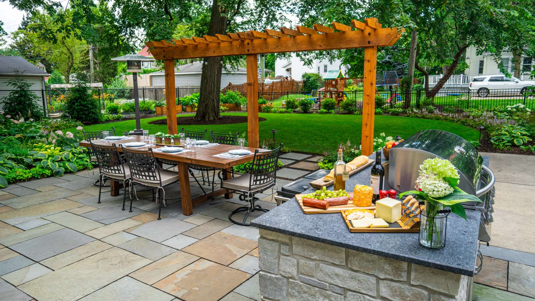 outdoor kitchen with pergola patio and patio furniture