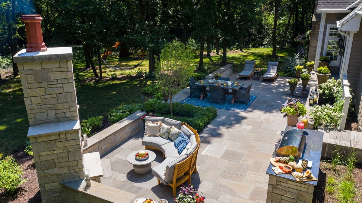 patio with outdoor kitchen and fireplace