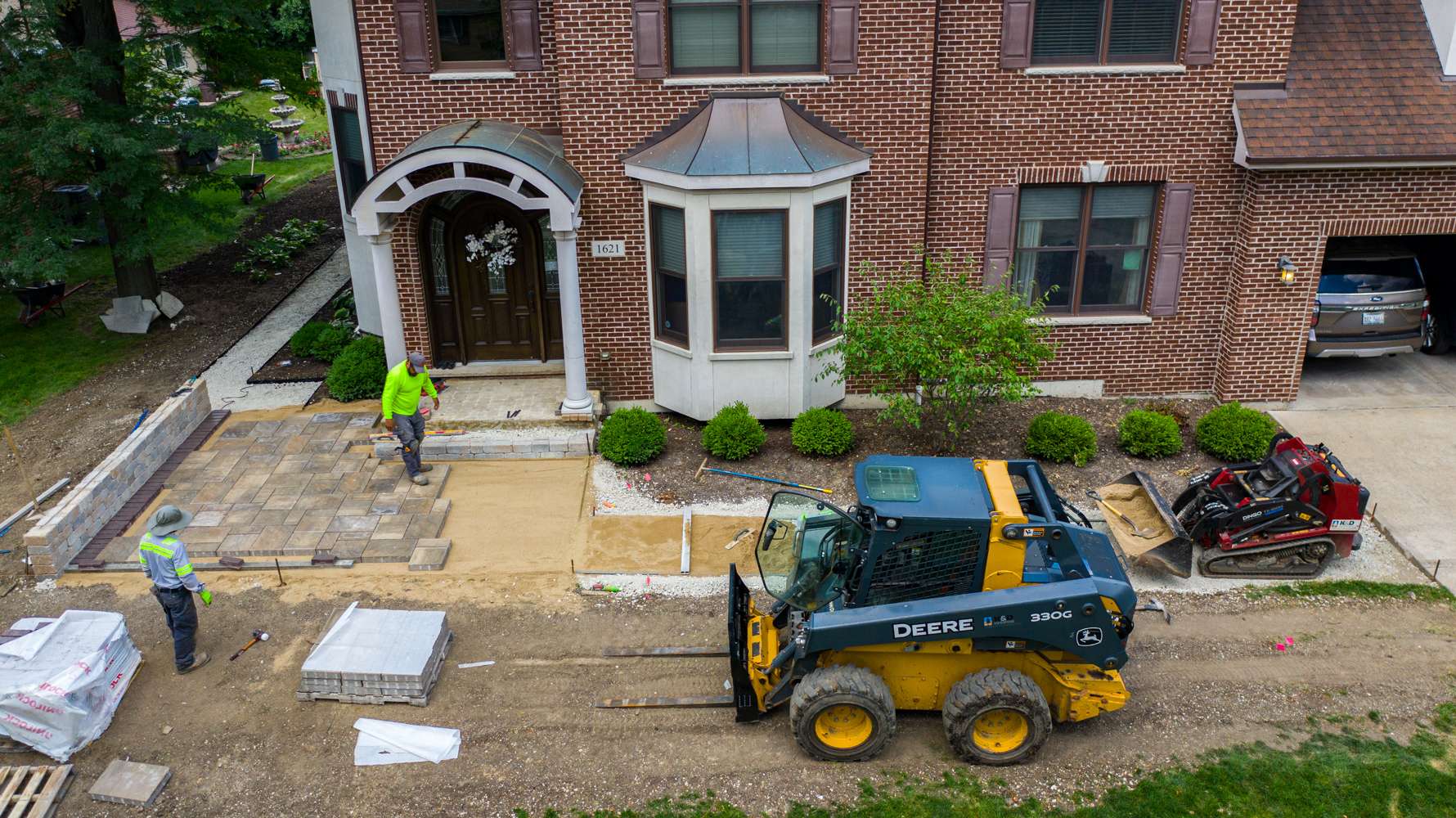 Hardscape installation crews putting in a paver walkway