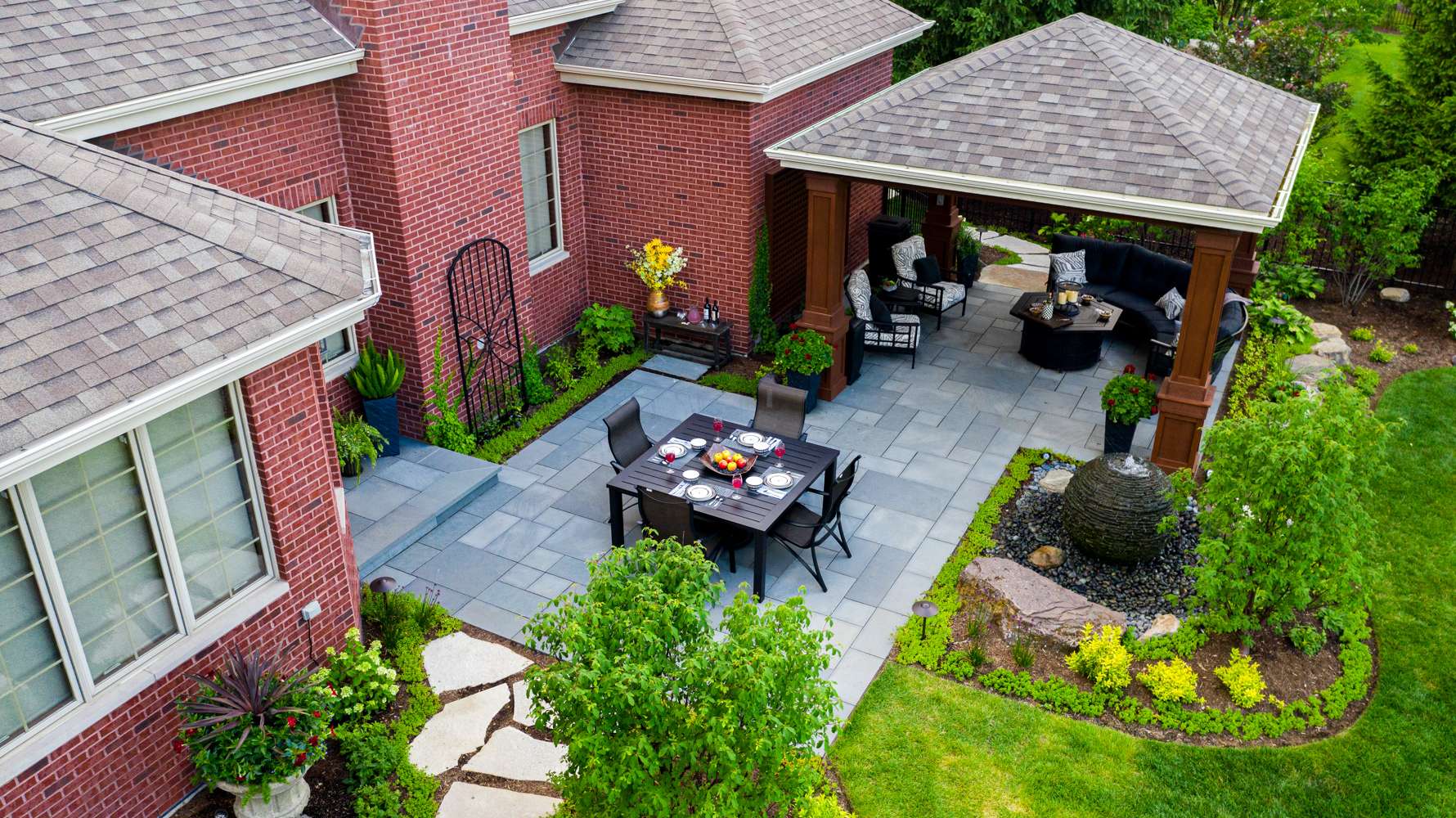 aerial-pergola-patio-paver-seatin-water feature-planting-plants-lawn-natural stone-trellis-container