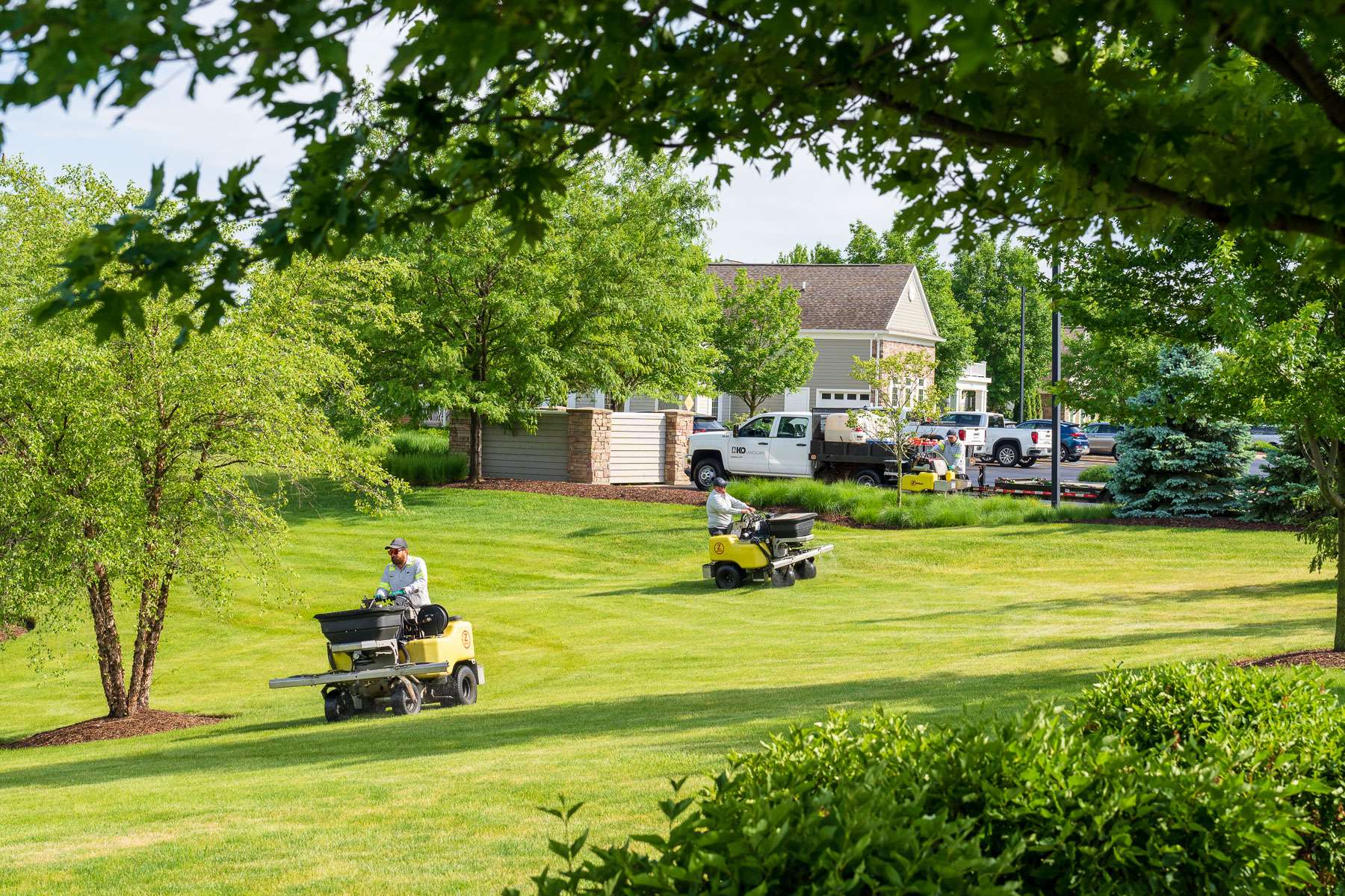 commercial lawn care technician spraying 19