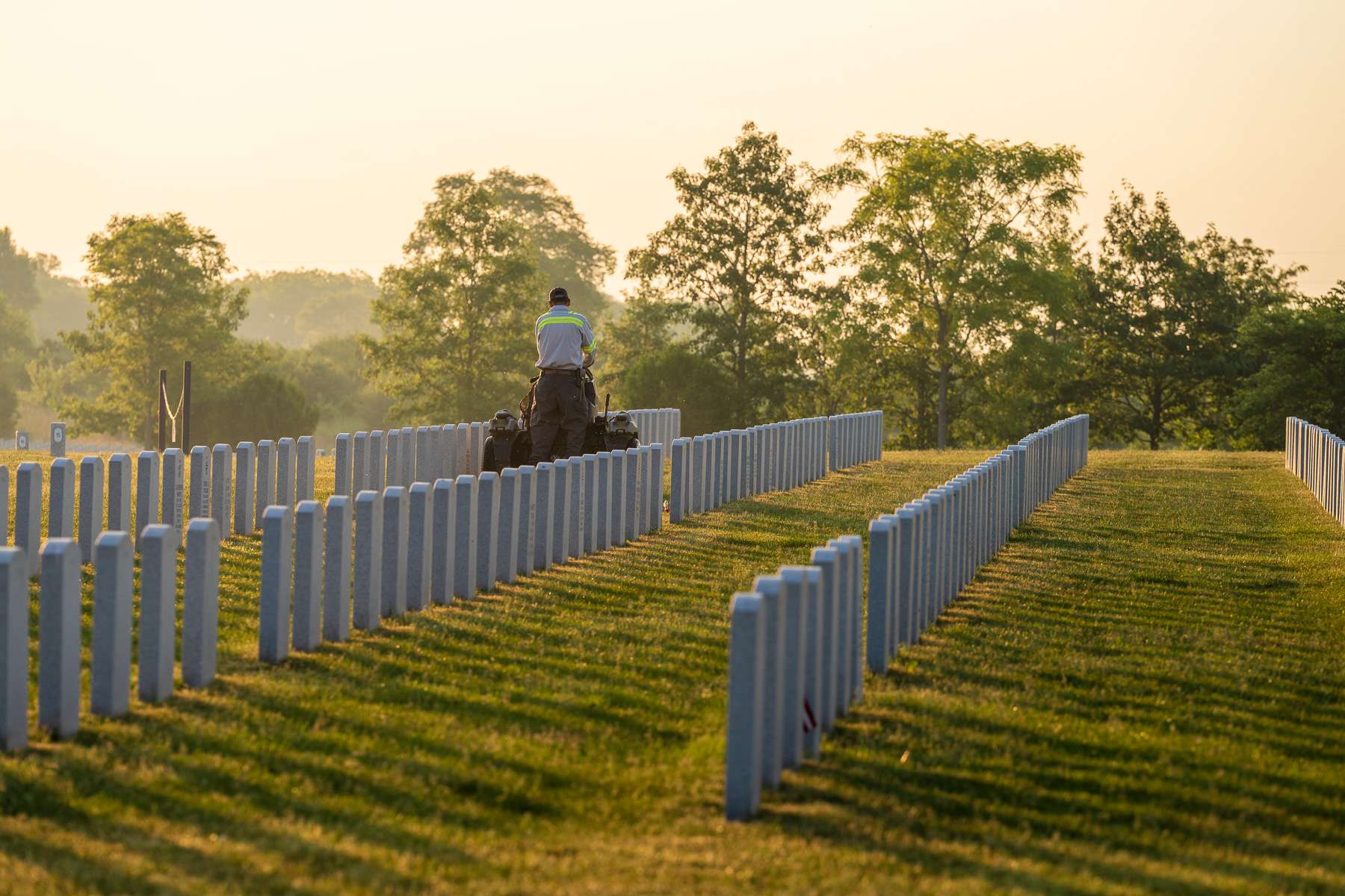 commercial maintenance technician mowing cemetary 2