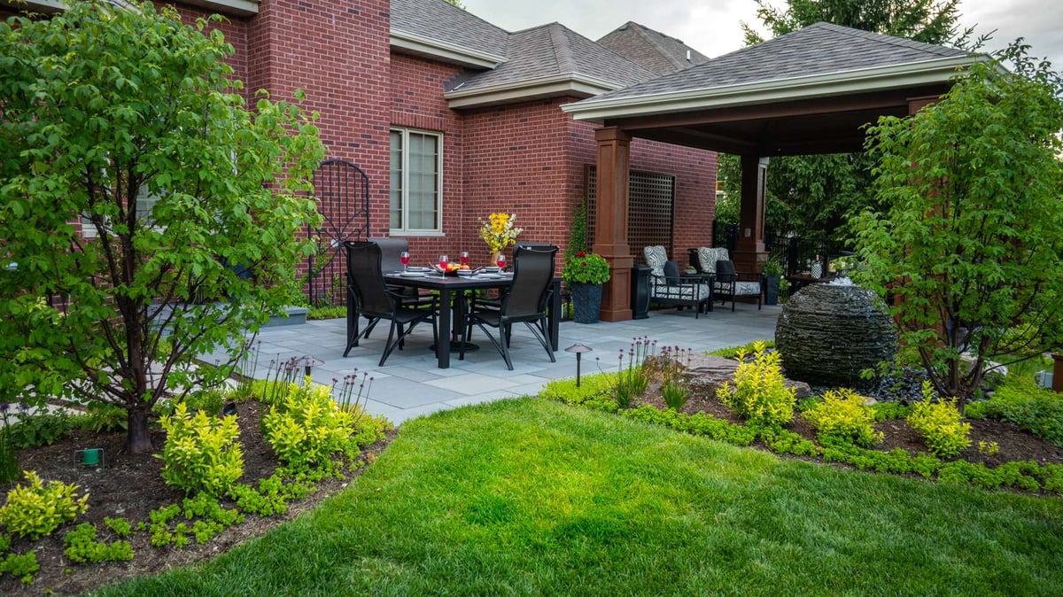 patio and pavilion with seating areas and water feature