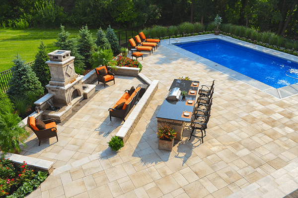 Outdoor living space with fireplace, patio and outdoor kitchen