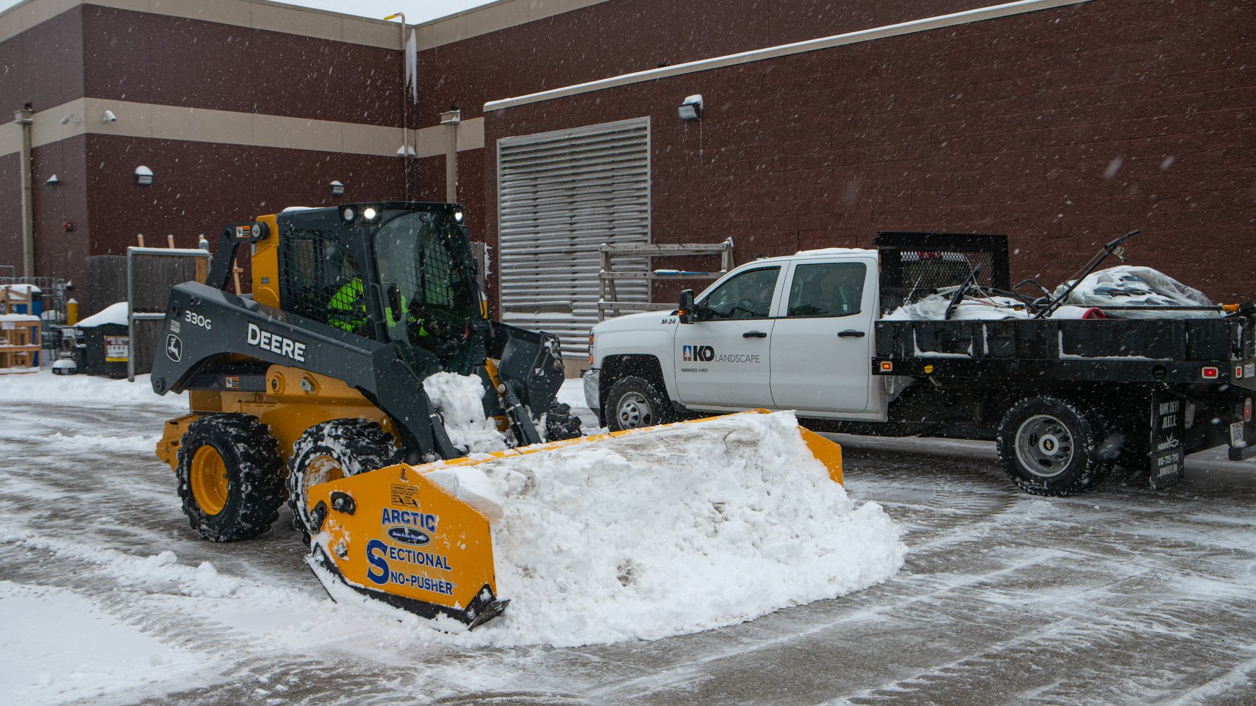 Commercial Snow Removal skidsteer plow truck equipment