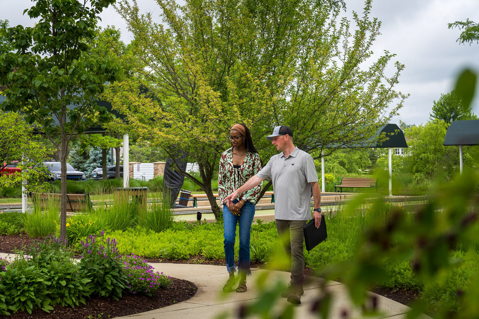 landscaper and HOA property manager reviewing a landscape bed
