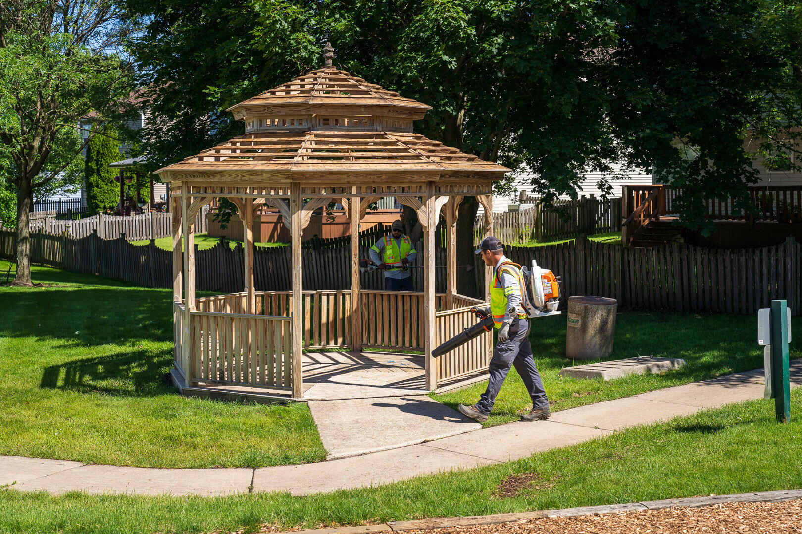 commercial hoa crew blowing cleaning gazebo