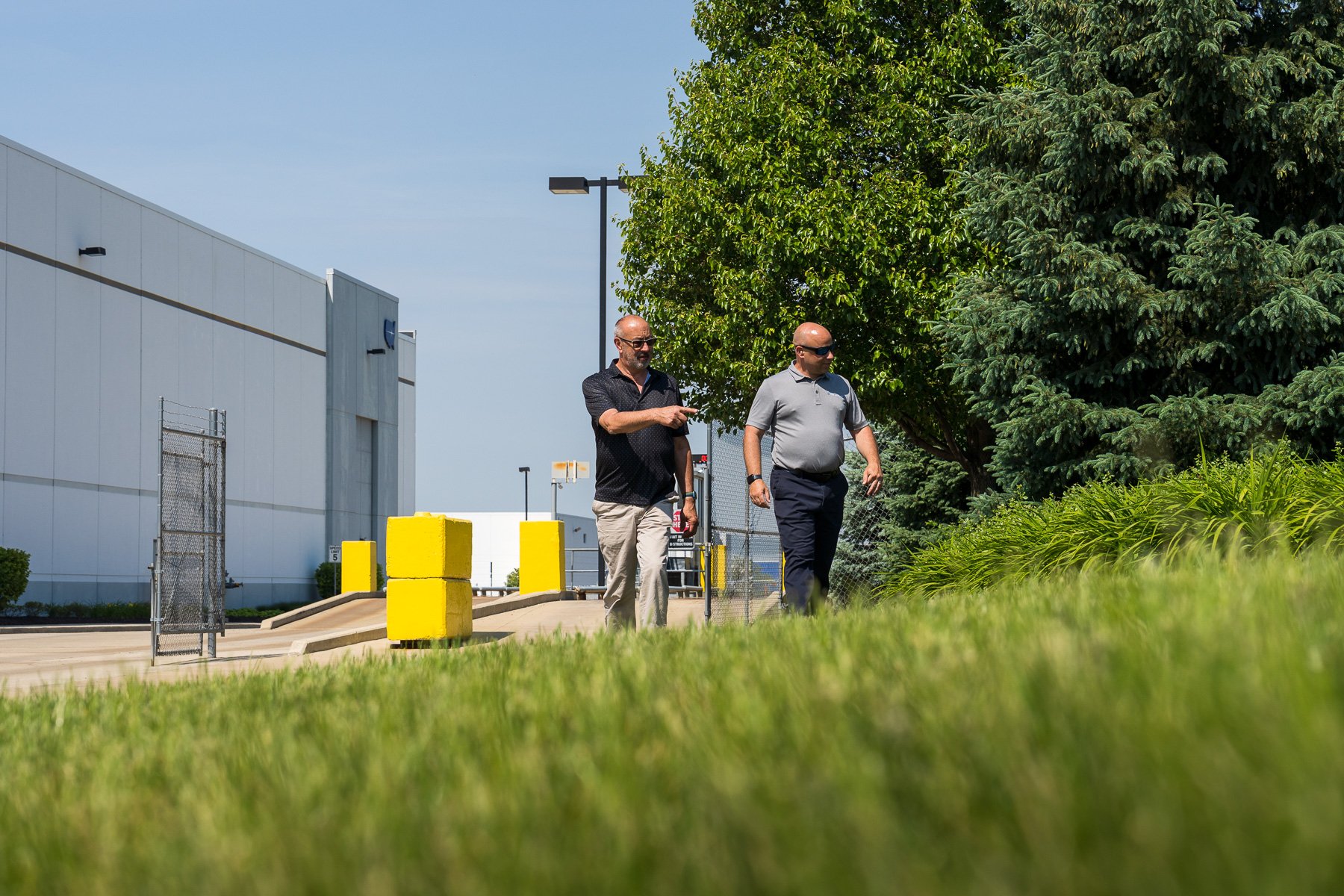 property manager and landscape account manager reviewing an industrial facility landscapes