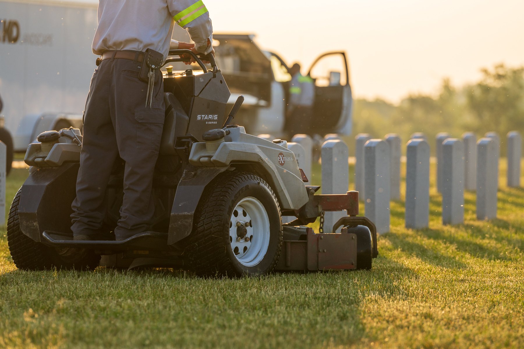 commercial maintenance technician mowing cemetary 7