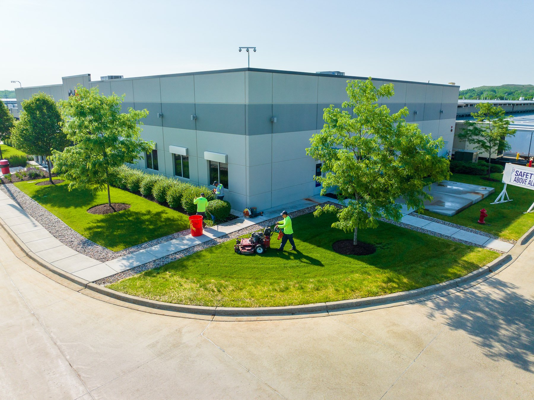 commercial maintenance technicians mowing warehouse 2