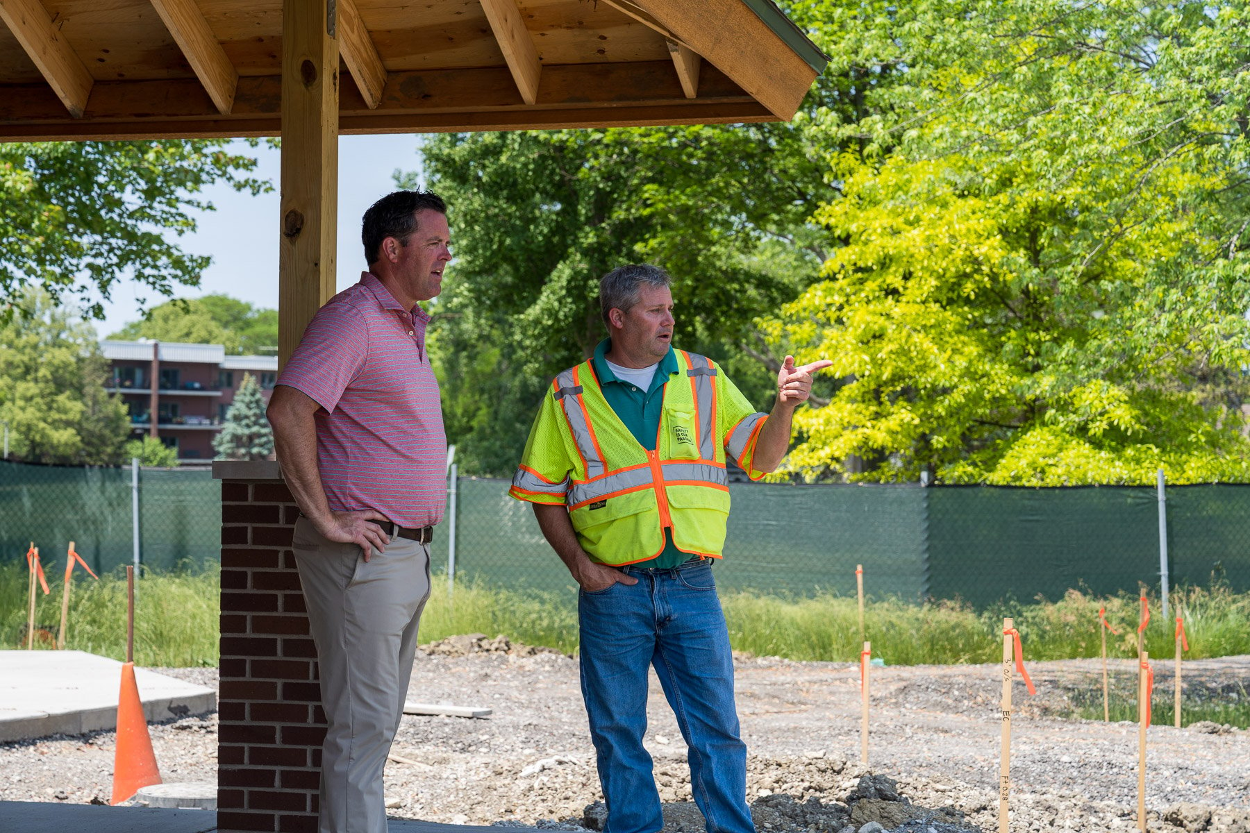 construction superintendent and commercial landscape owner reviewing an ongoing landscape installation