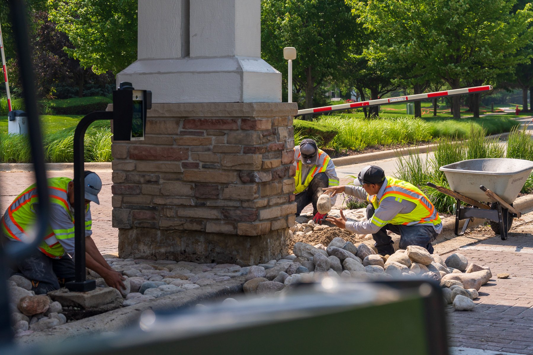 hoa crew team enhancements river rock sign hardscape plants 18
