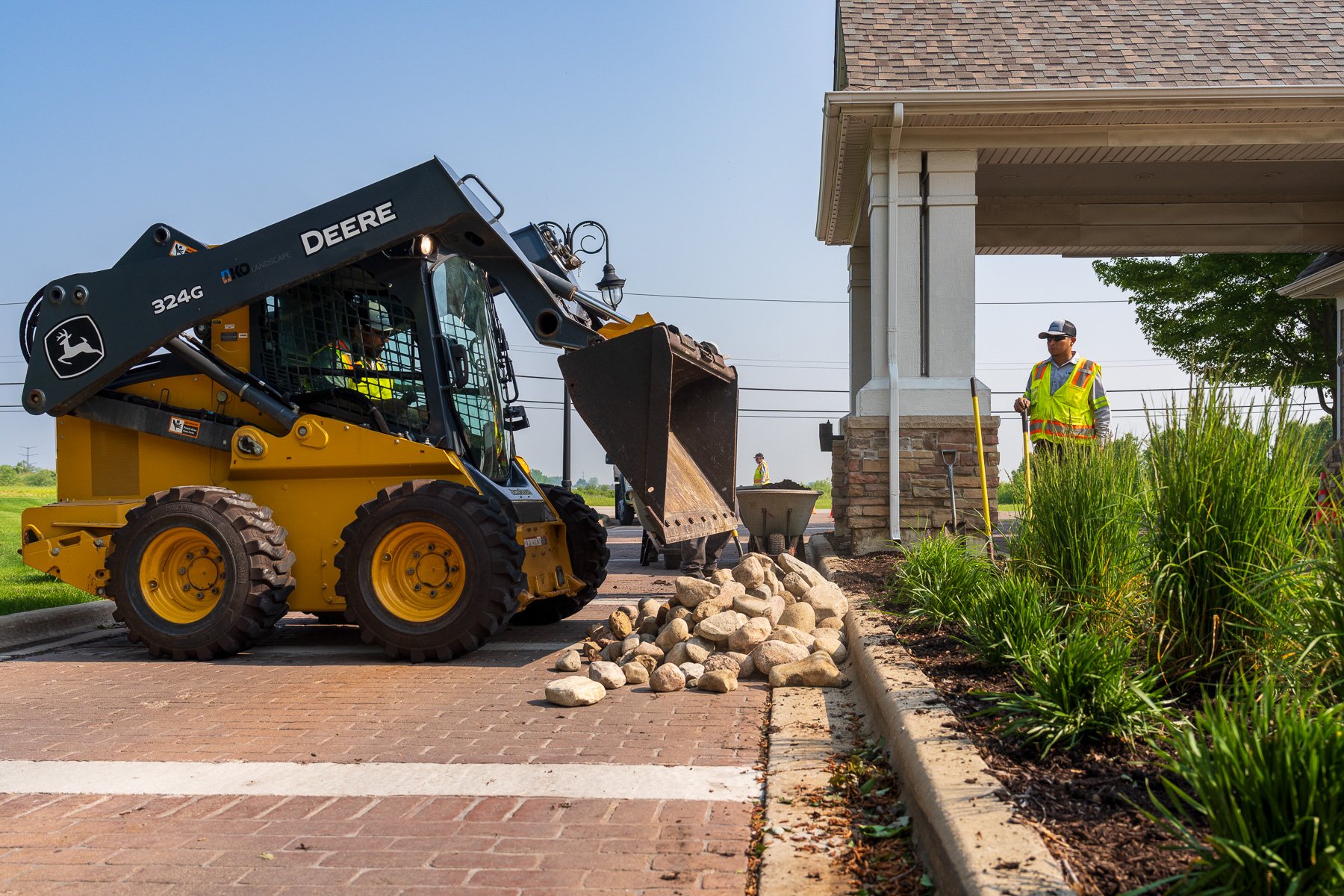 hoa enhancements crew team planting grading soil mulch rock machine 5