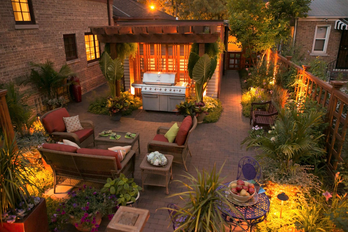 patio with pergola grill seating and container gardens