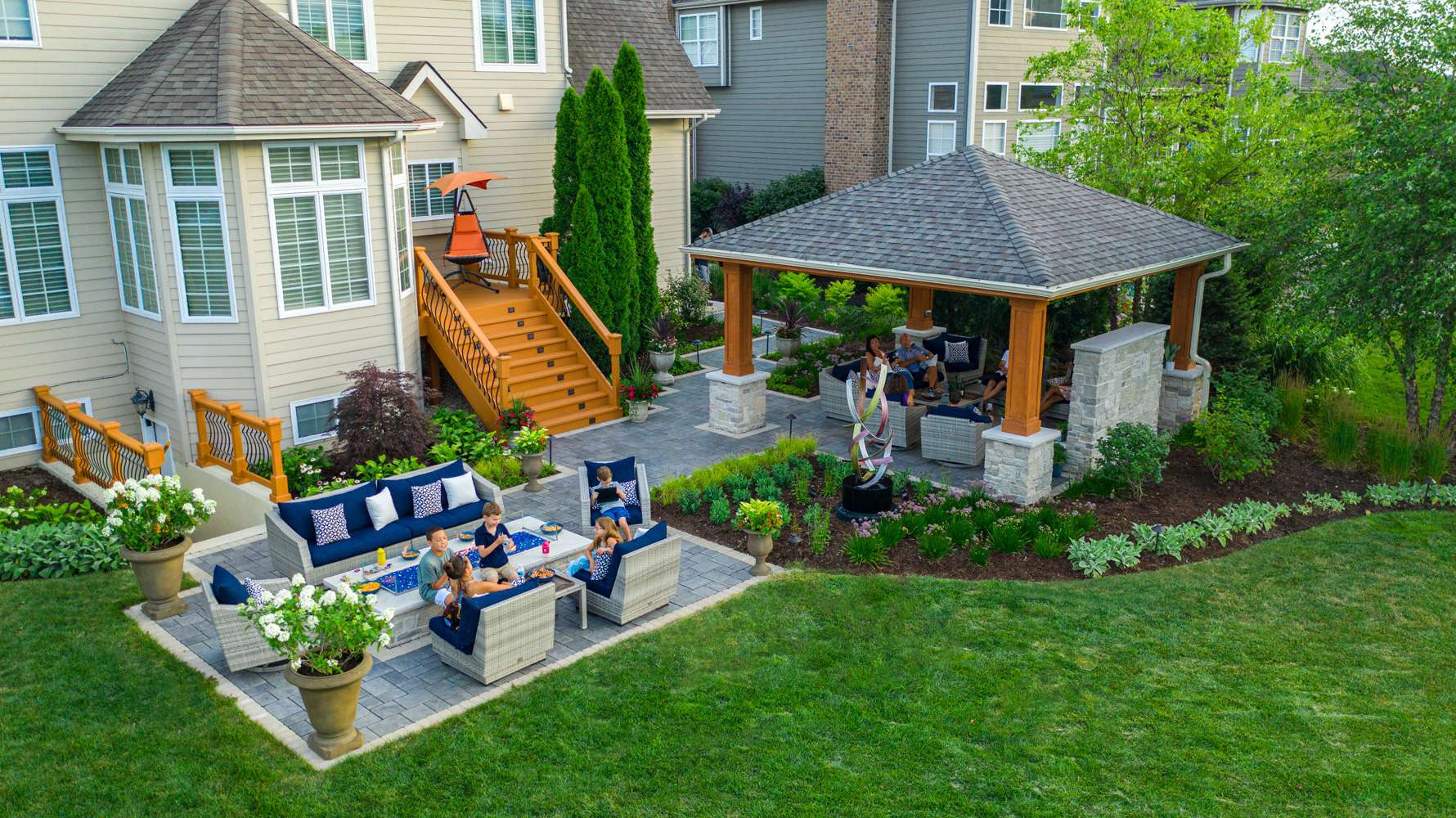 aerial-fire feature-sculpture-pergola-customer-patio-paver-seating-container-landscaping-plants-planting-lawn-steps