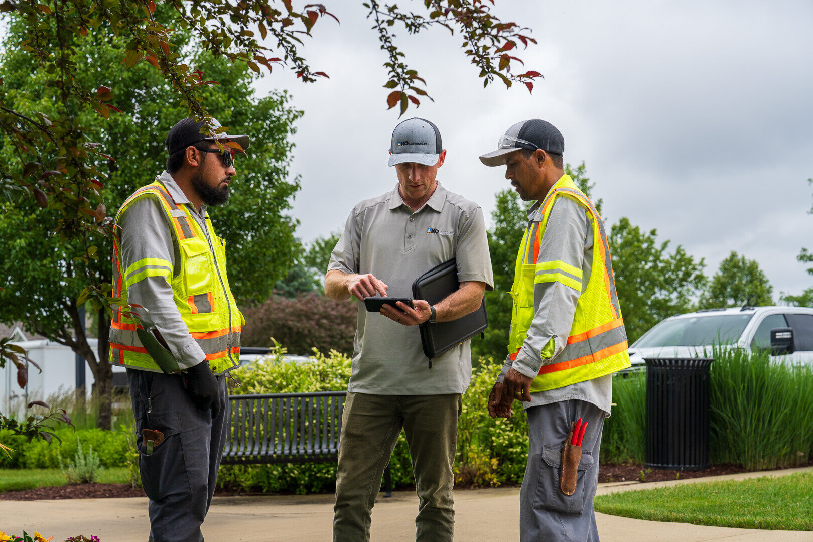 commercial HOA account manager and crew reviewing project 4