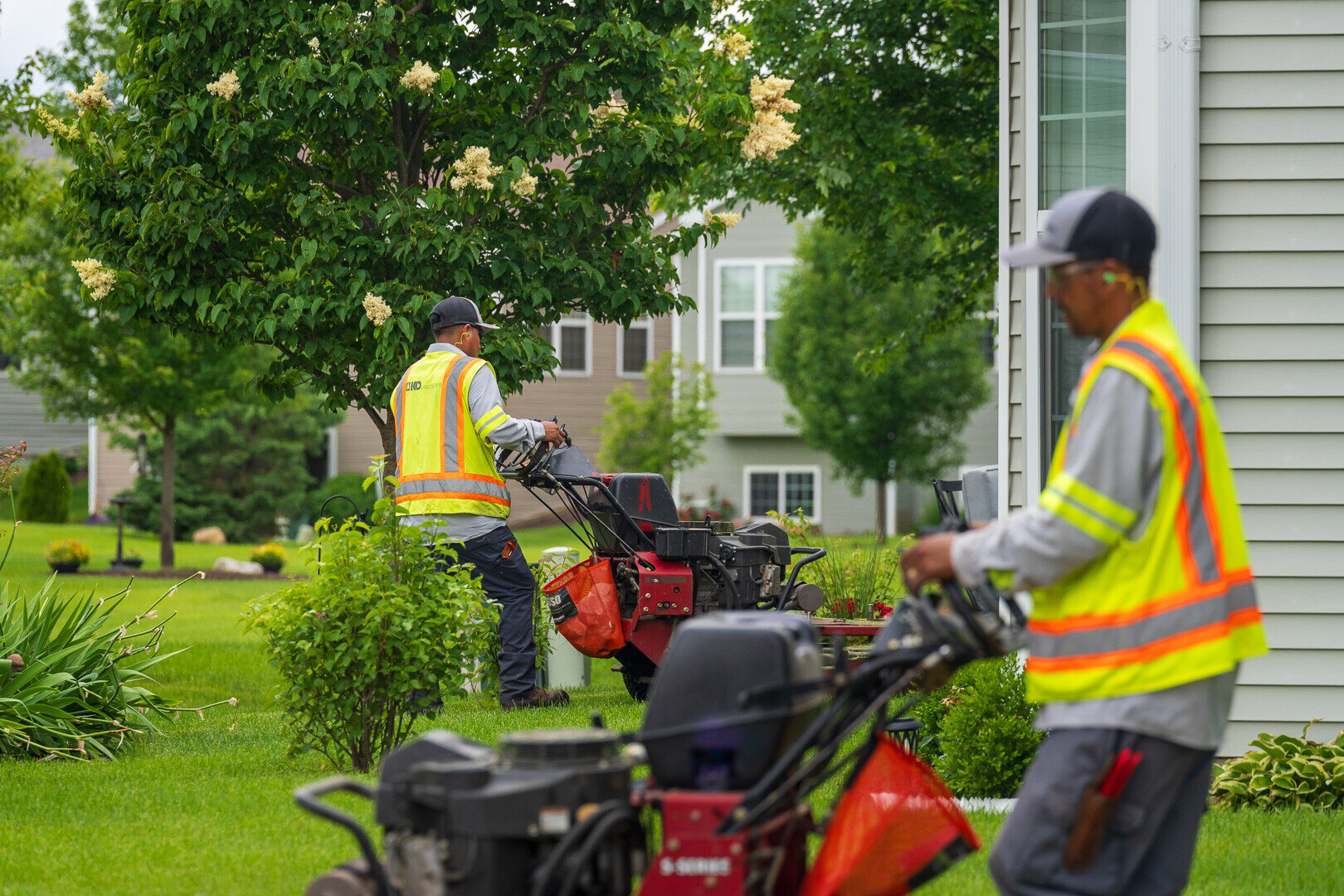 commercial mow crew mowing HOA lawn