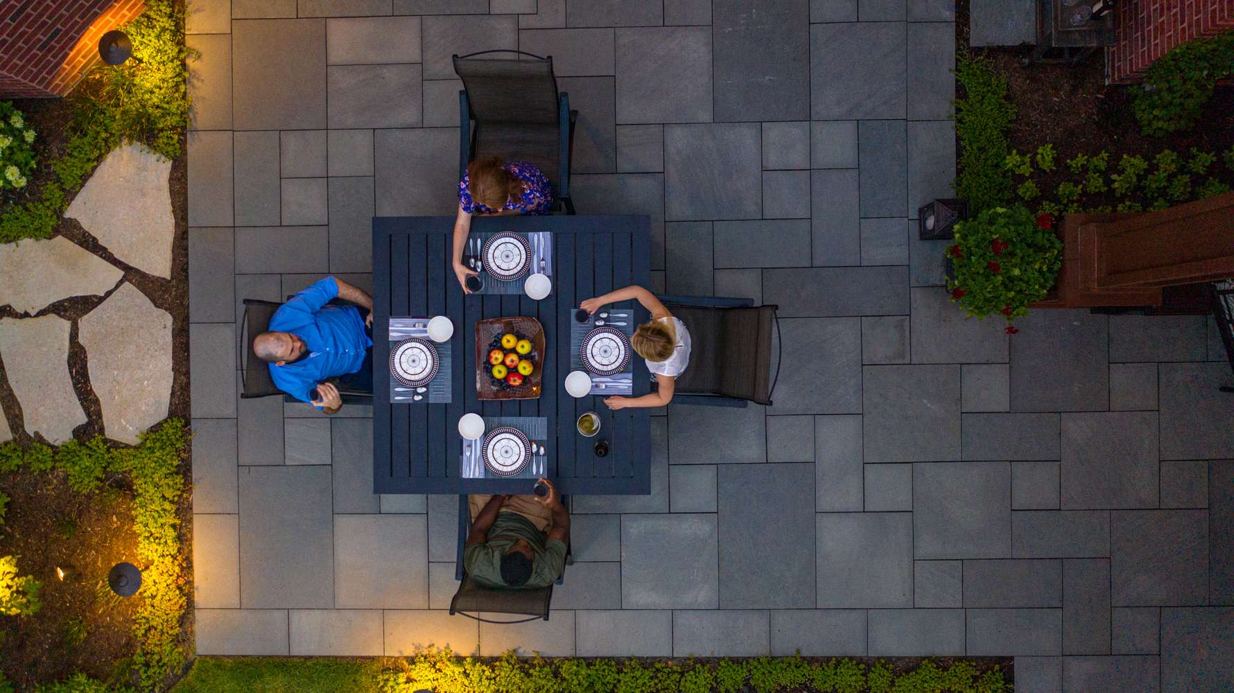 people enjoying dinner on bluestone patio